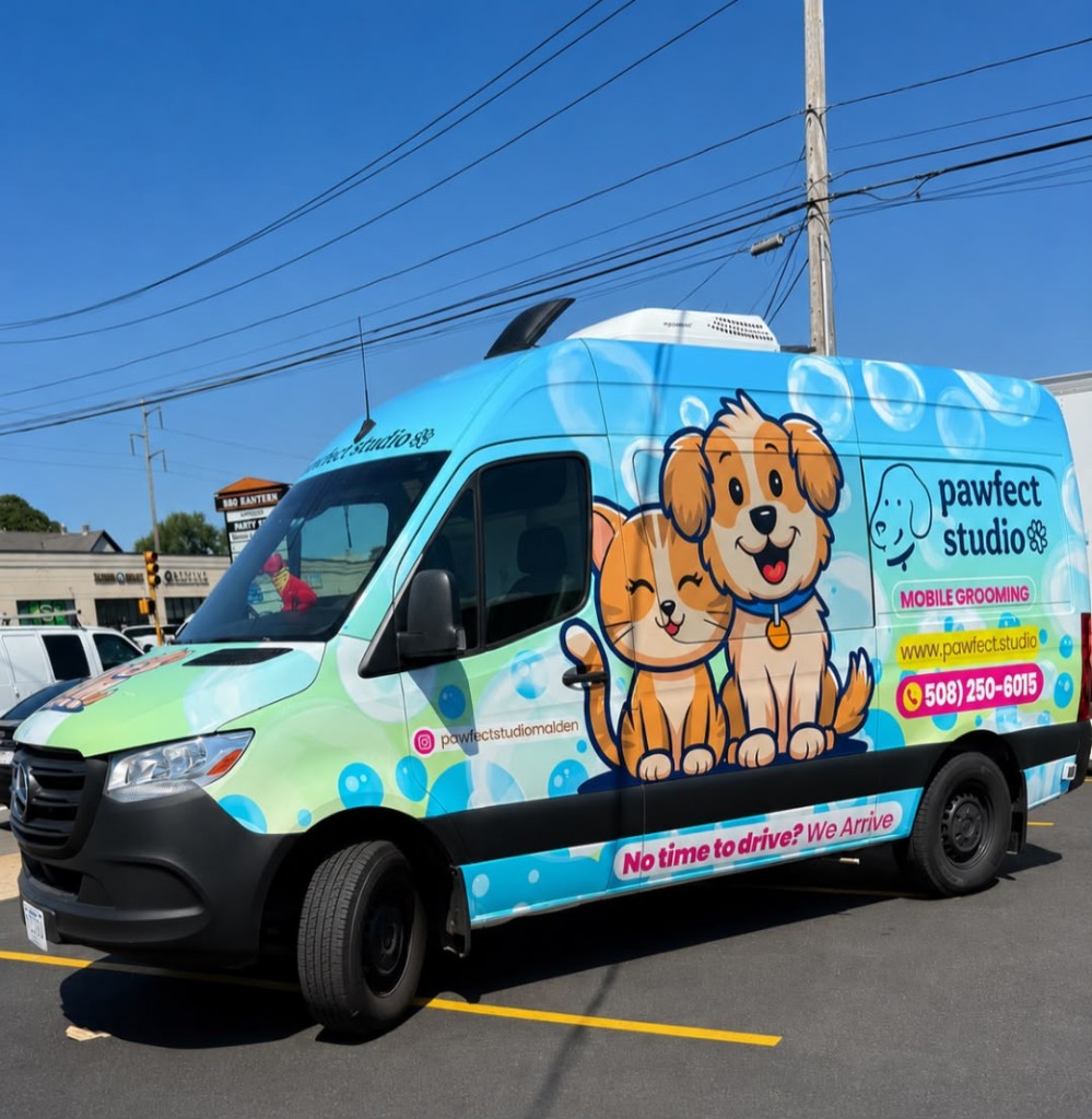Pawfect Studio mobile grooming van with branded wrap parked outdoors